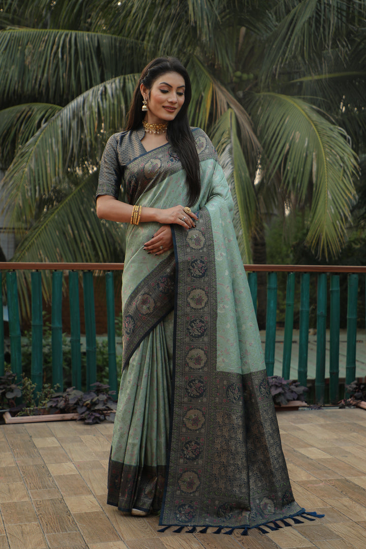 Radiant green Kanjivaram saree with intricate borders and a graceful drape, perfect for weddings and cultural celebrations.