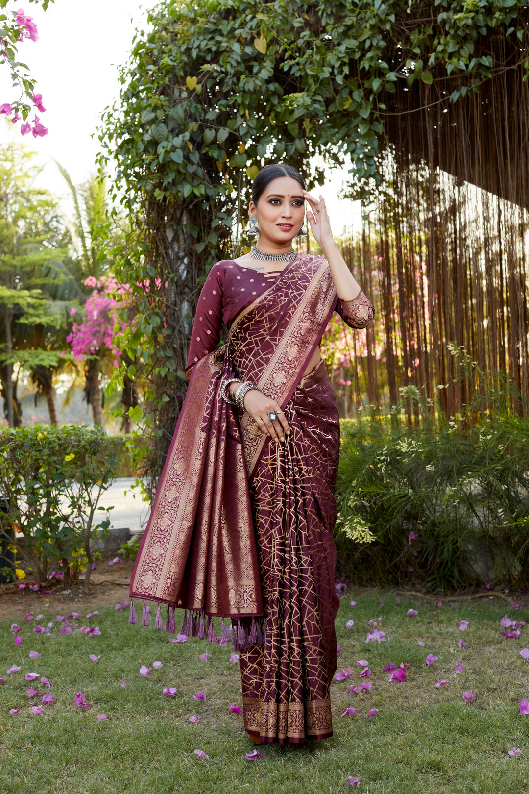 Beautiful wine Kanjivaram soft satin silk saree with rich butta work, ideal for grand weddings and festivals.