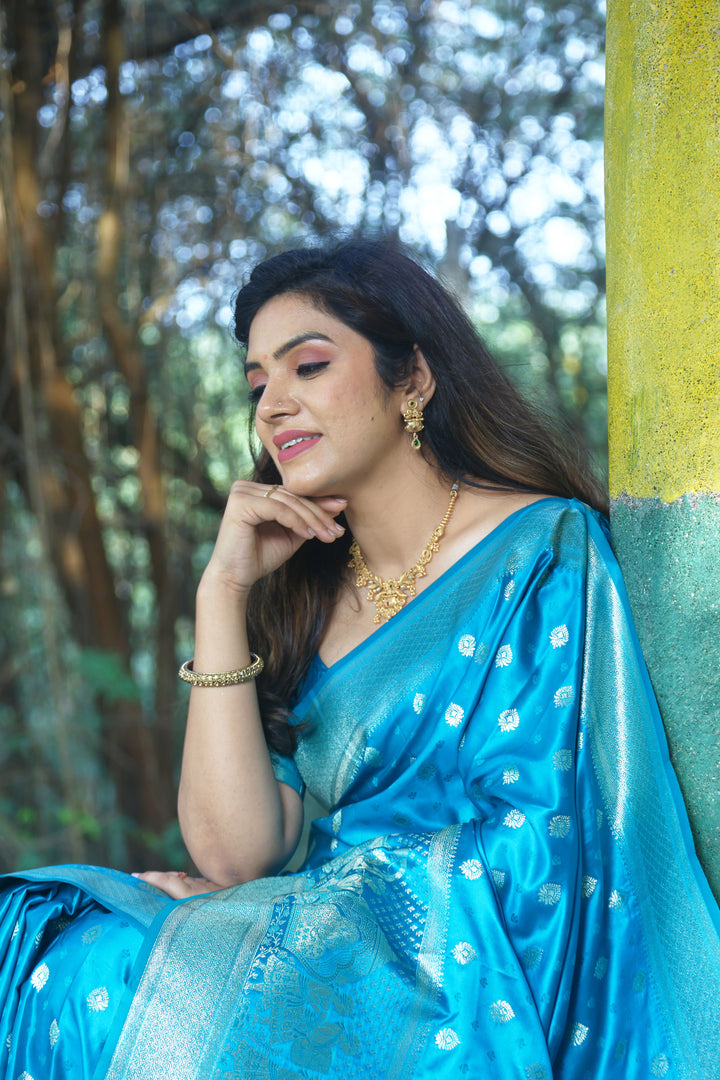 Elegant blue satin silk saree with luxurious Kanjivaram weaving, a perfect choice for sophisticated events.