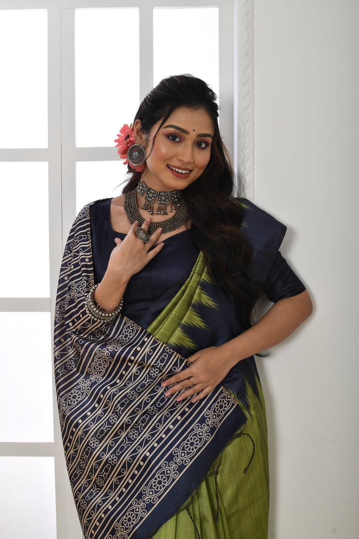 Elegant Tussar silk saree with a printed temple border and traditional fabric pattern, perfect for special events.