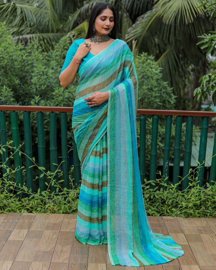 Embrace elegance in this sky blue Moss chiffon saree, featuring a graceful design and shimmering gold foil details, ideal for festive events.