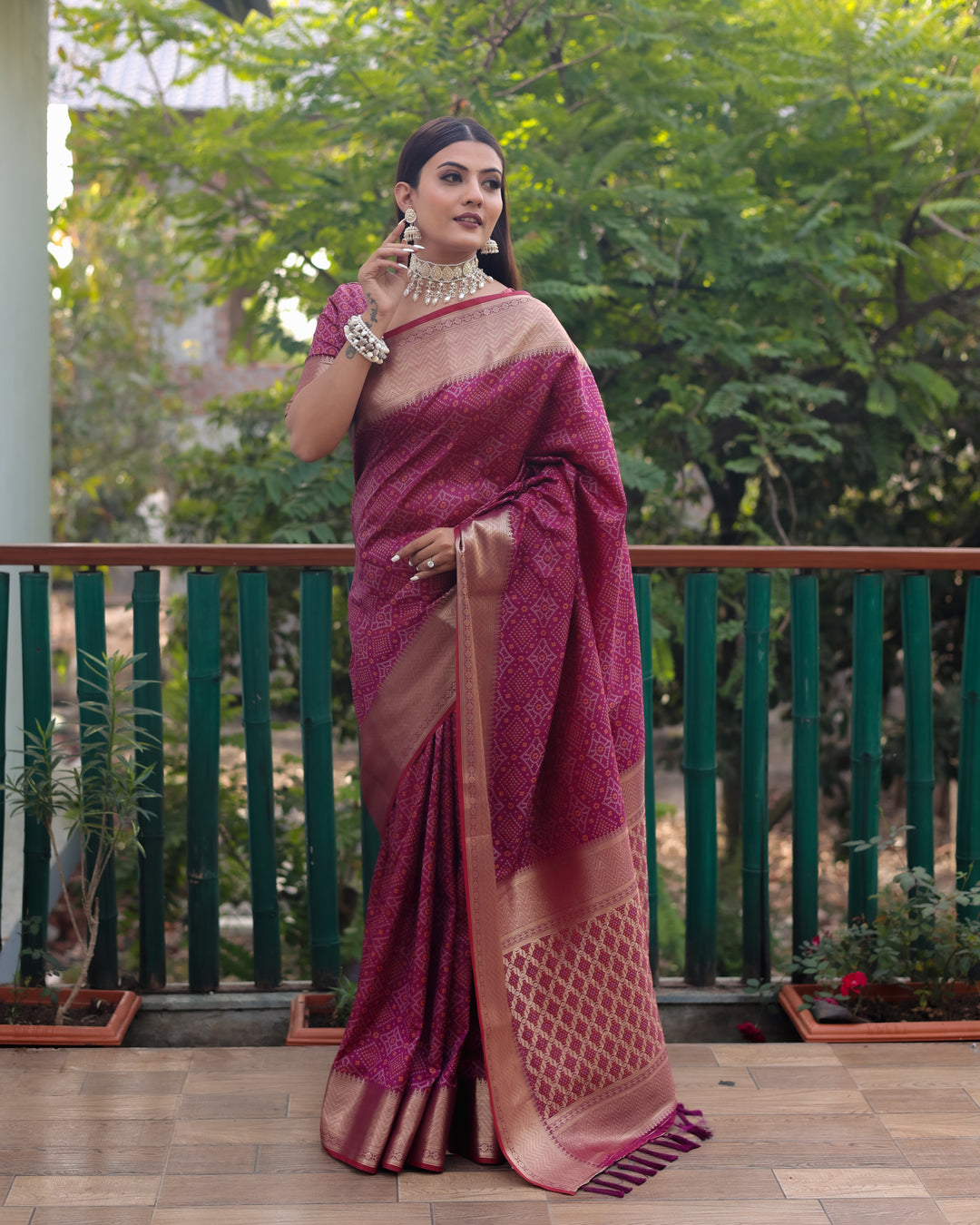 Soft and lightweight maroon saree with intricate Bandhej designs, blending traditional craftsmanship with modern elegance.