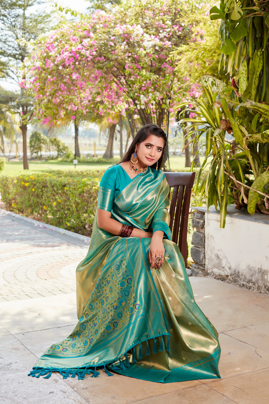 Stunning green tissue silk saree with intricate border and contrast blouse, ideal for cultural events.