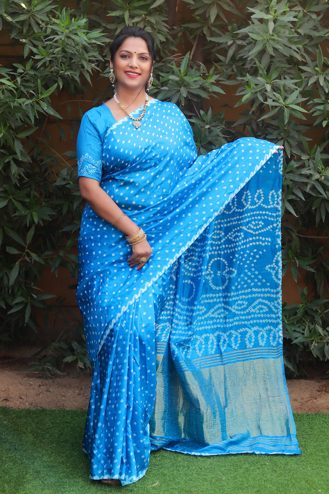 Sky blue Bandhej silk saree with Lagdi Patta and Zari woven pallu, an elegant choice for weddings and festive events.