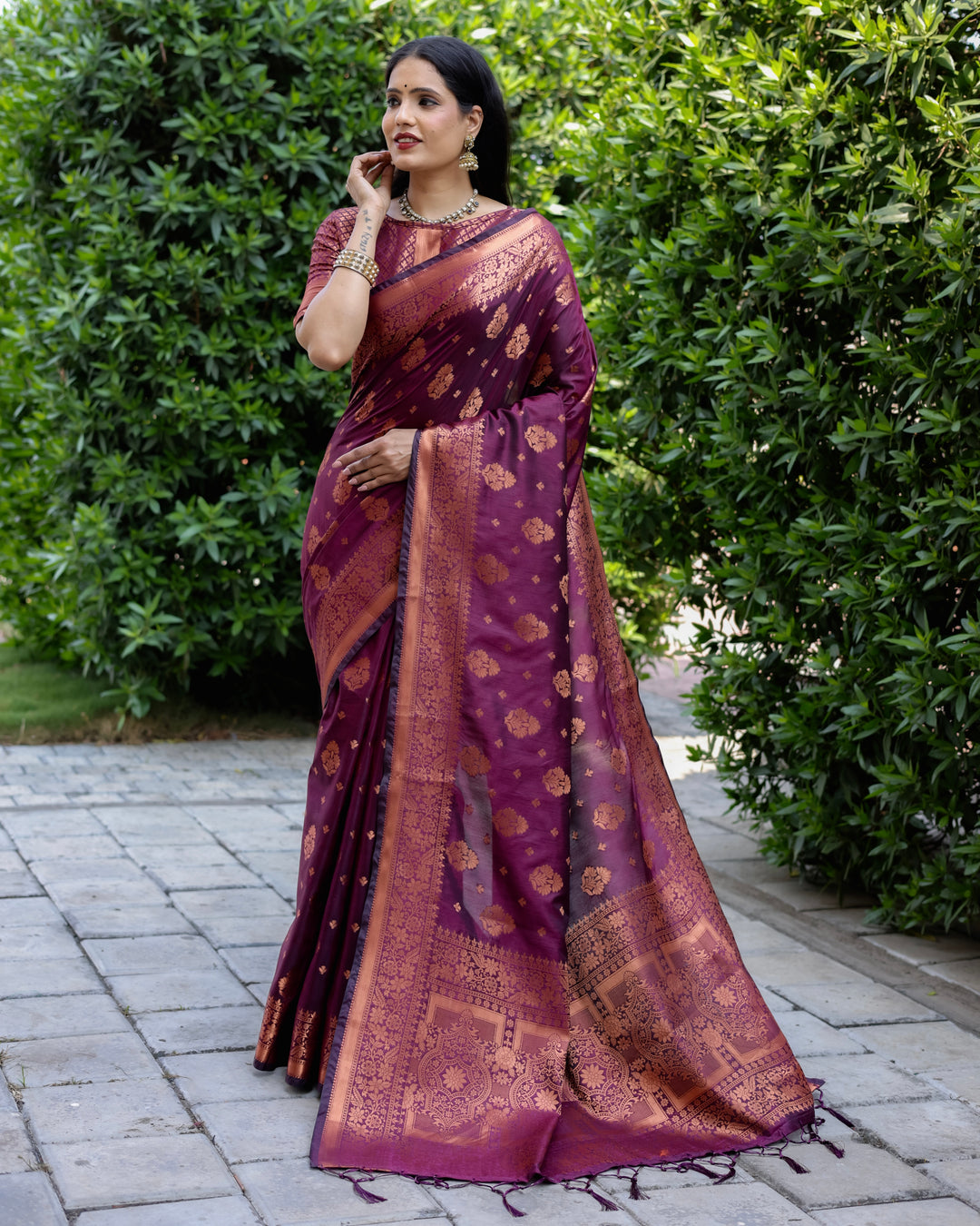 Luxury purple soft silk saree with contrast borders and a detailed woven pallu, ideal for making a statement at weddings.