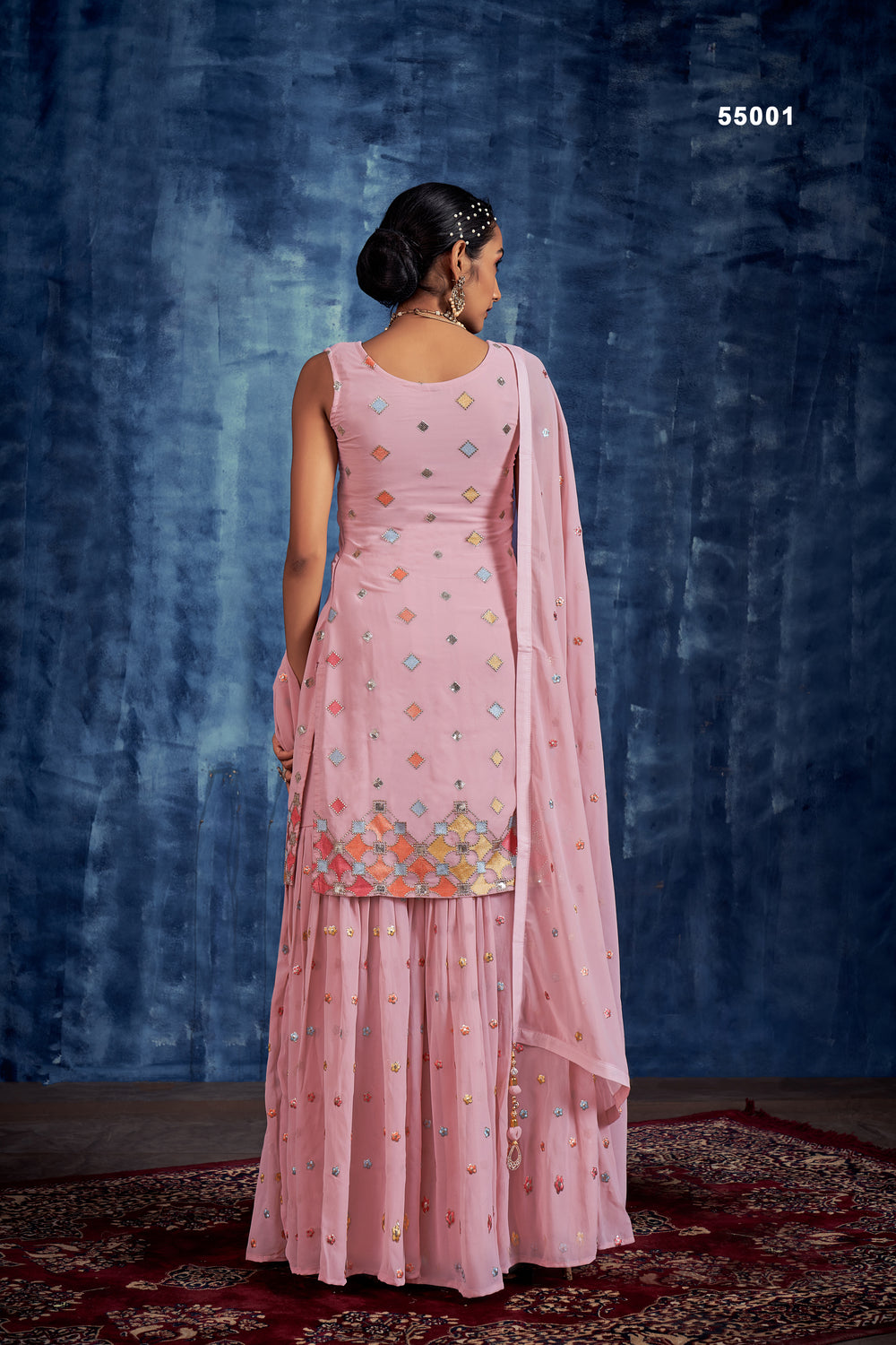 Multi embroidery baby pink sharara suit with georgette top and pleated palazzo.