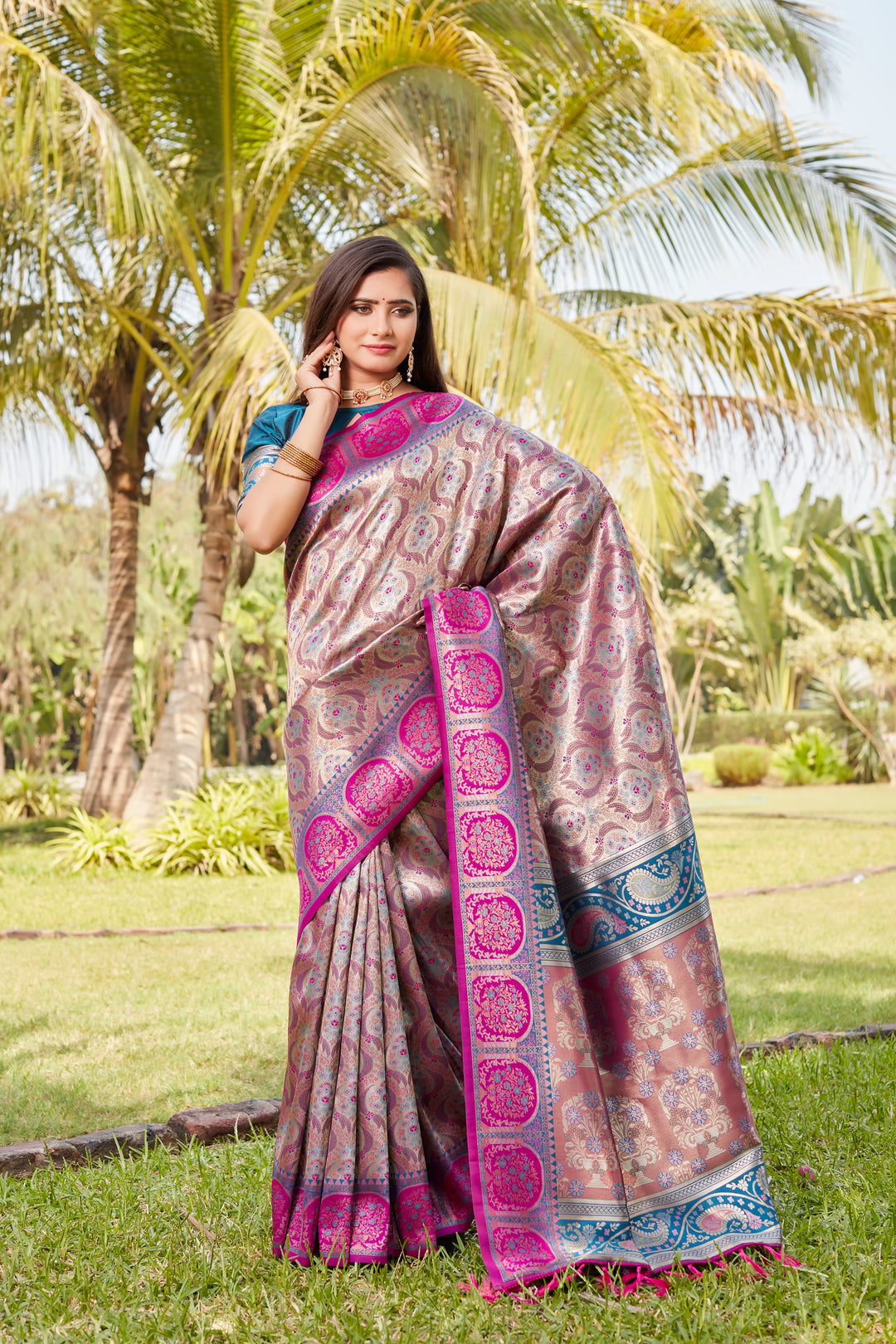 Bright-pink Kanjivaram soft silk saree with intricate work and rich pallu, perfect for weddings.