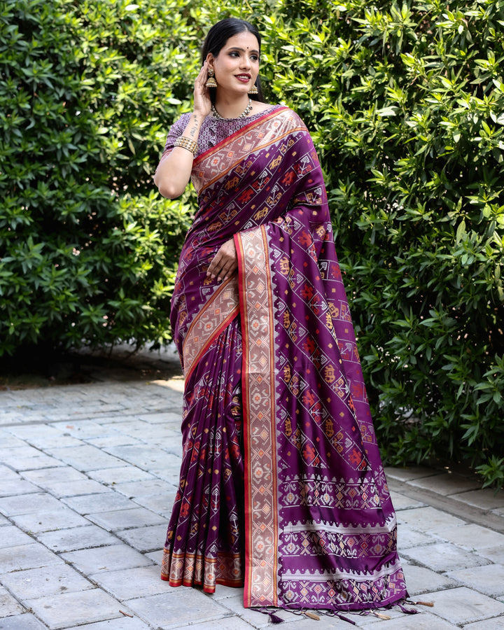 Beautiful purple Bandhej silk saree with zari pallu and matching blouse, ideal for luxurious celebrations.