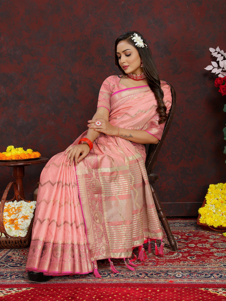 Designer peach silk saree with exquisite zari weaving, perfect for formal events.