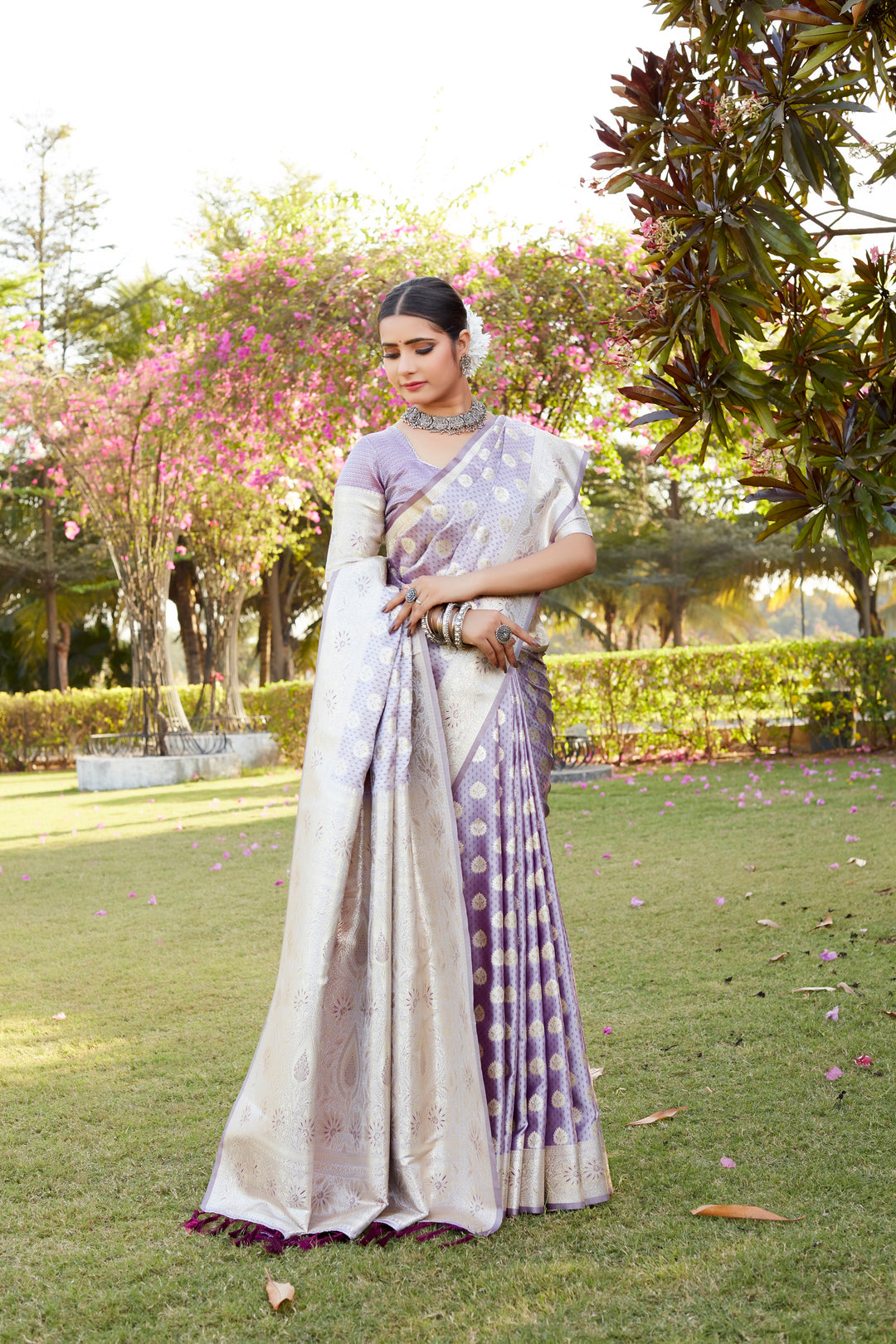 Dazzling purple Kanjivaram Soft Satin Silk saree with shining satin finish and intricate butta work for a festive vibe.