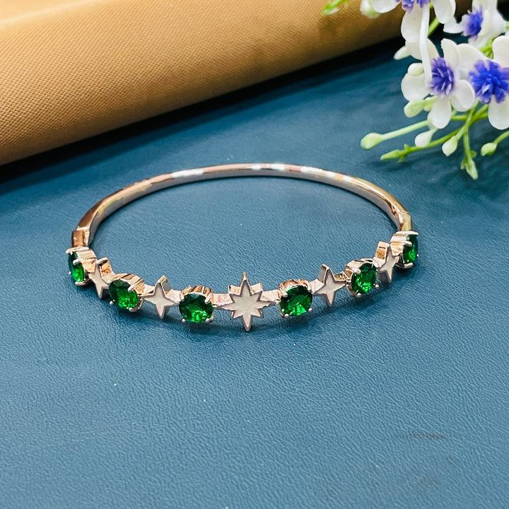 Stylish rose gold bracelet with a dainty star charm, perfect for stacking.