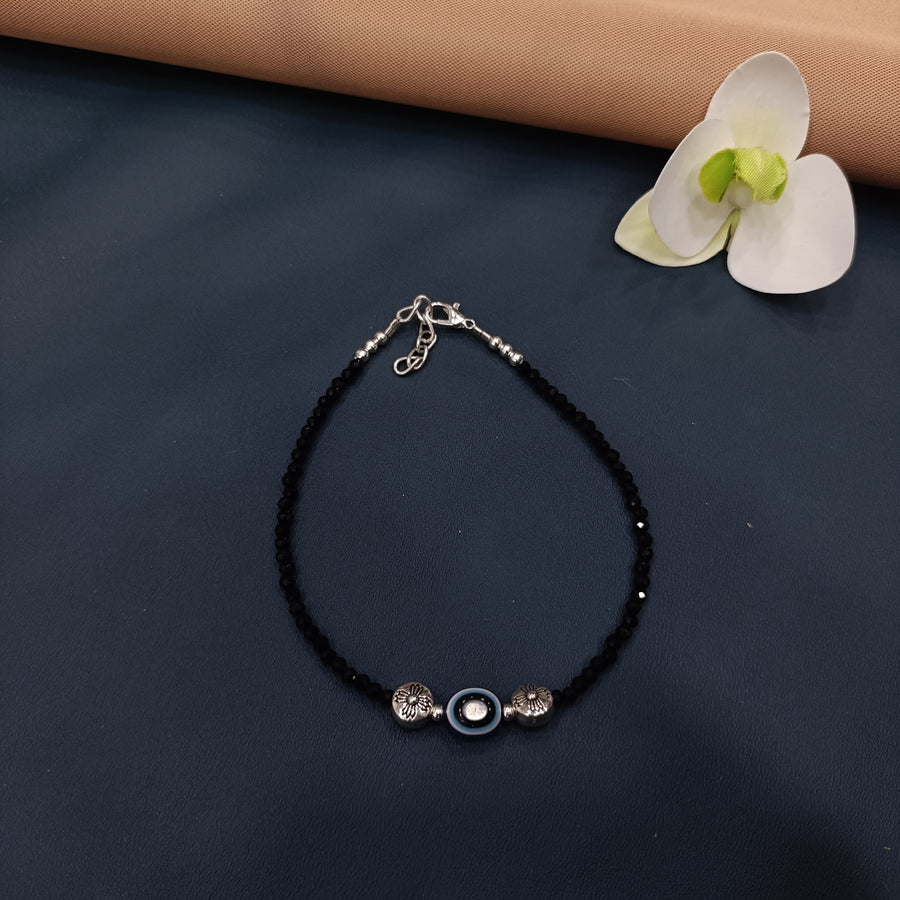 Chic silver anklet with beads, crafted for a casual, boho summer look.