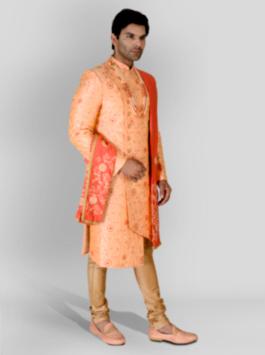 Shine at weddings in the USA with this stylish Peach Indo-Western Set, crafted from luxurious silk and adorned with intricate embroidery.