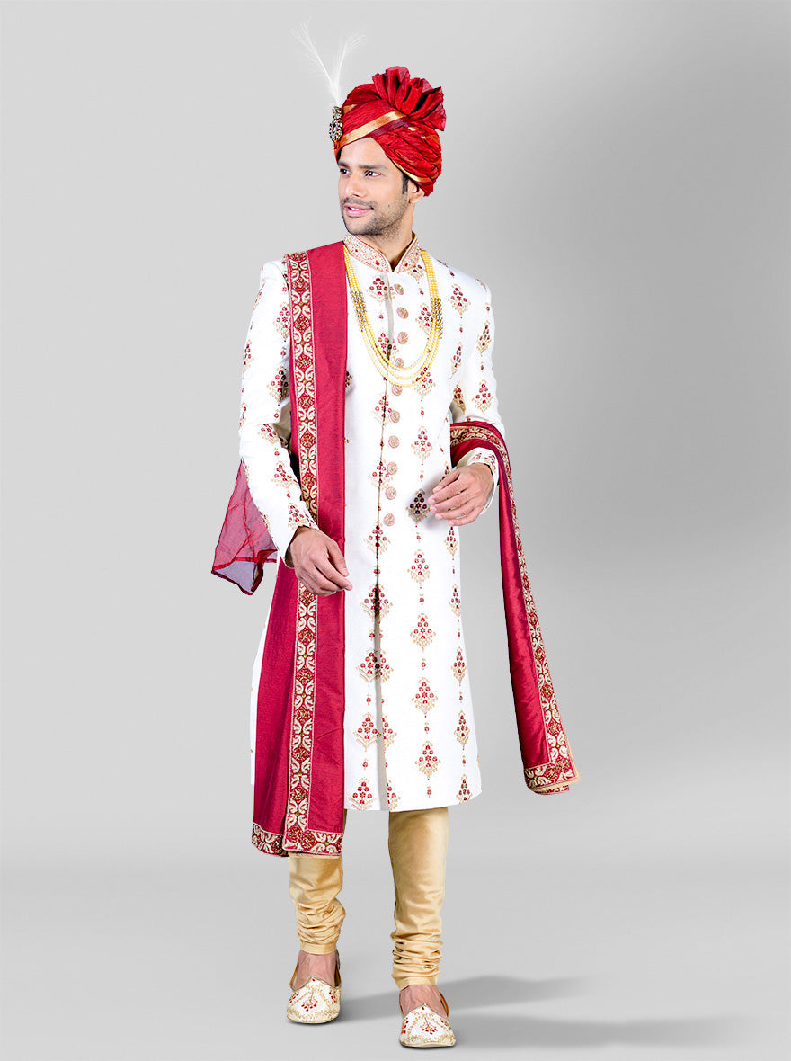 Elegant cream and maroon sherwani in a rich silk blend, perfect for grooms.