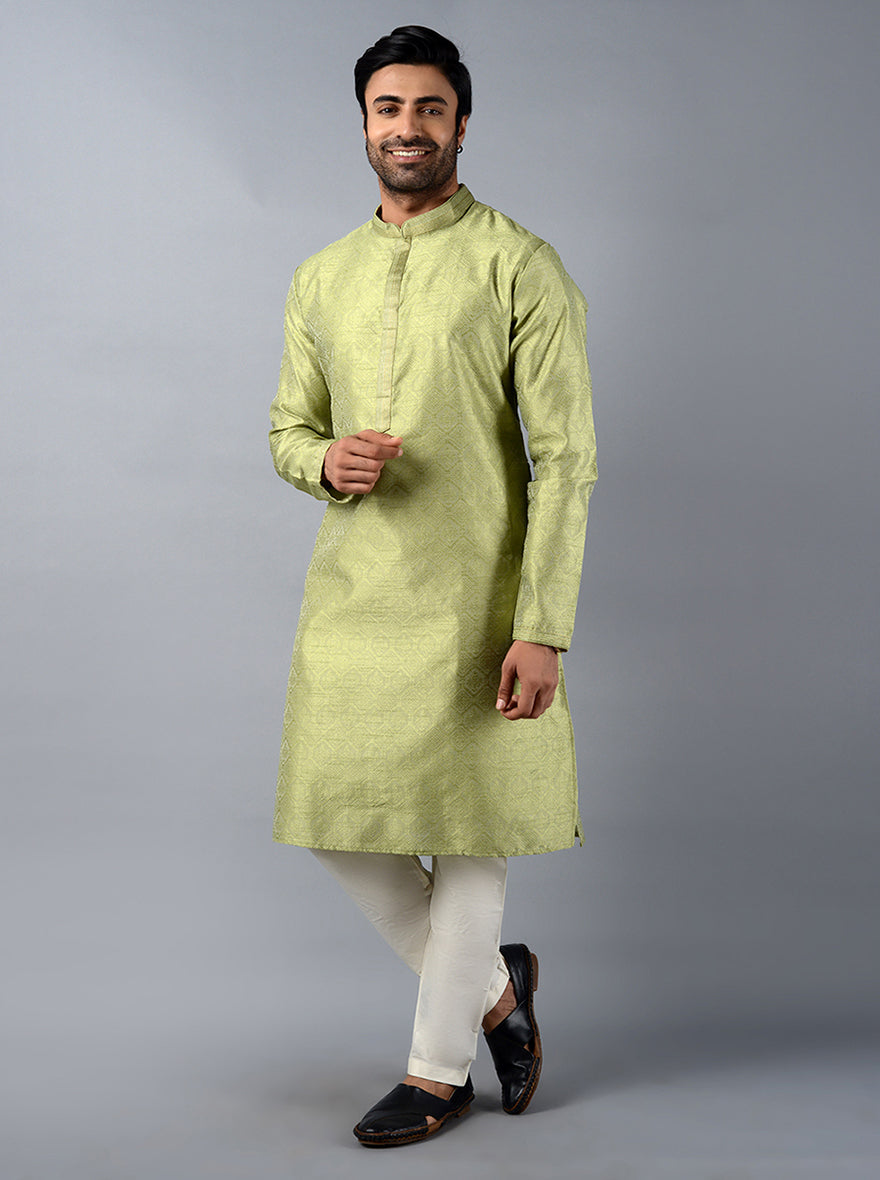 Experience comfort and luxury with this stunning green silk kurta set for festive events.