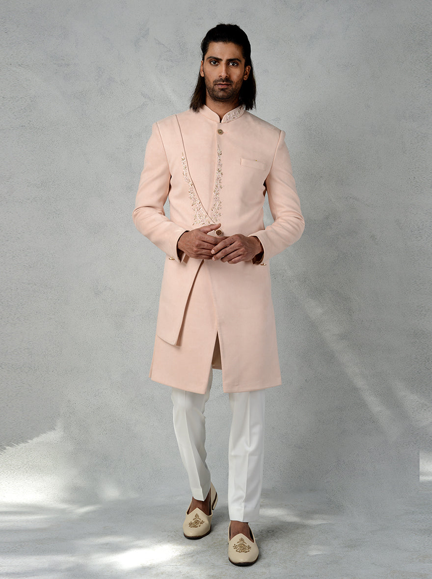 Add a touch of sophistication to your wardrobe with this Peach layered Indo Western, complete with floral hand embroidery, perfect for USA men's fashion.