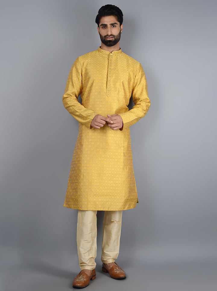 Celebrate in style with this luxurious bright yellow kurta set for festive occasions.