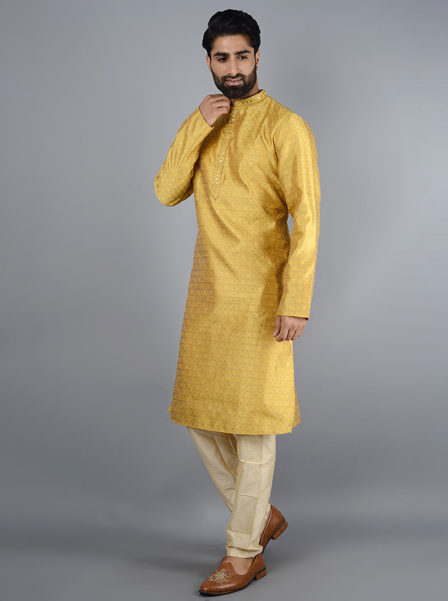 Make a statement in this bright yellow silk kurta set for festive celebrations.