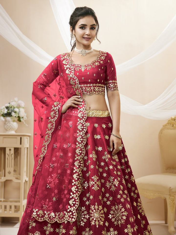 Vibrant red Art Silk Lehenga Choli set featuring intricate embroidery and a matching dupatta, designed for weddings and special occasions.