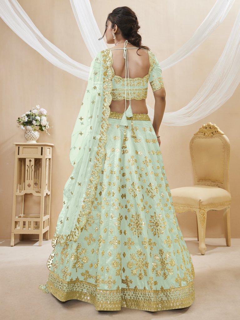 Elegant pista green Art Silk Lehenga Choli set with intricate embroidery and a beautiful dupatta, perfect for weddings and special events.