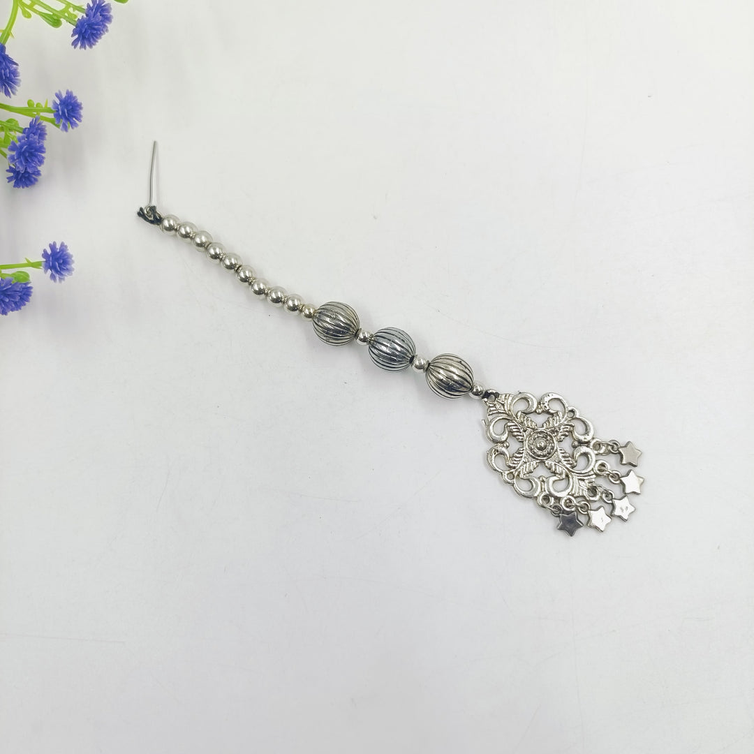 Modern oxidised maang tikka, perfect for brides seeking unique wedding accessories.