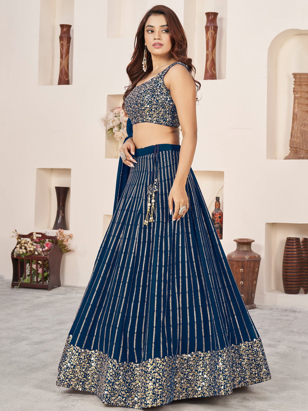 AwesomeÃ‚Â Blue Sequins Georgette Reception Wear Lehenga Choli