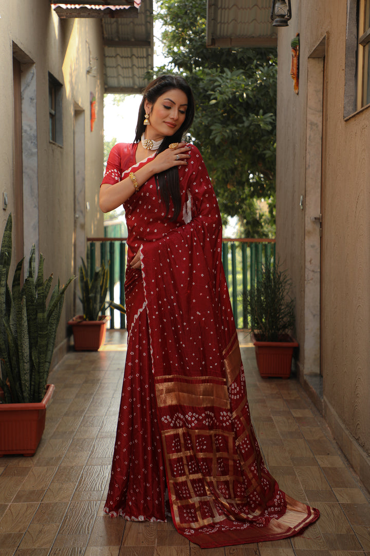 Timeless orange Bandhej silk saree with elegant checks design, perfect for cultural events.