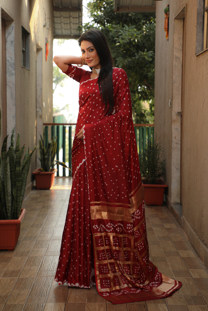 Elegant burgundy Bandhej silk saree with luxurious checks pattern, perfect for festive wear.