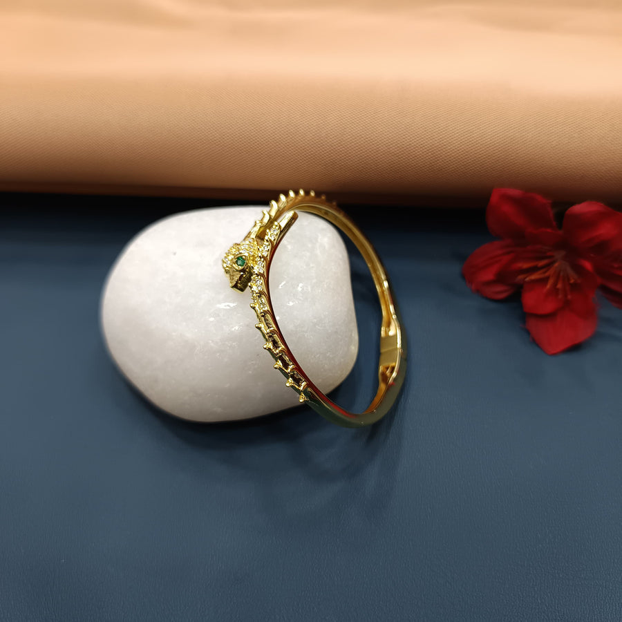 Timeless golden bracelet with a chic bangle design.