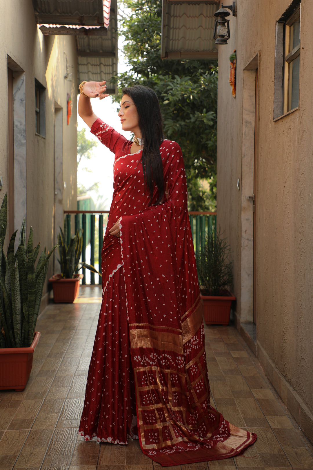 Beautiful burgundy Bandhej silk saree with original craft and bold checks design.