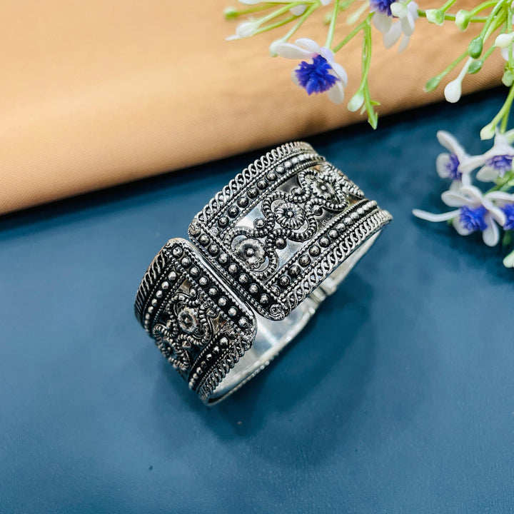 Elegant oxidised bracelet featuring delicate filigree work, suitable for weddings.