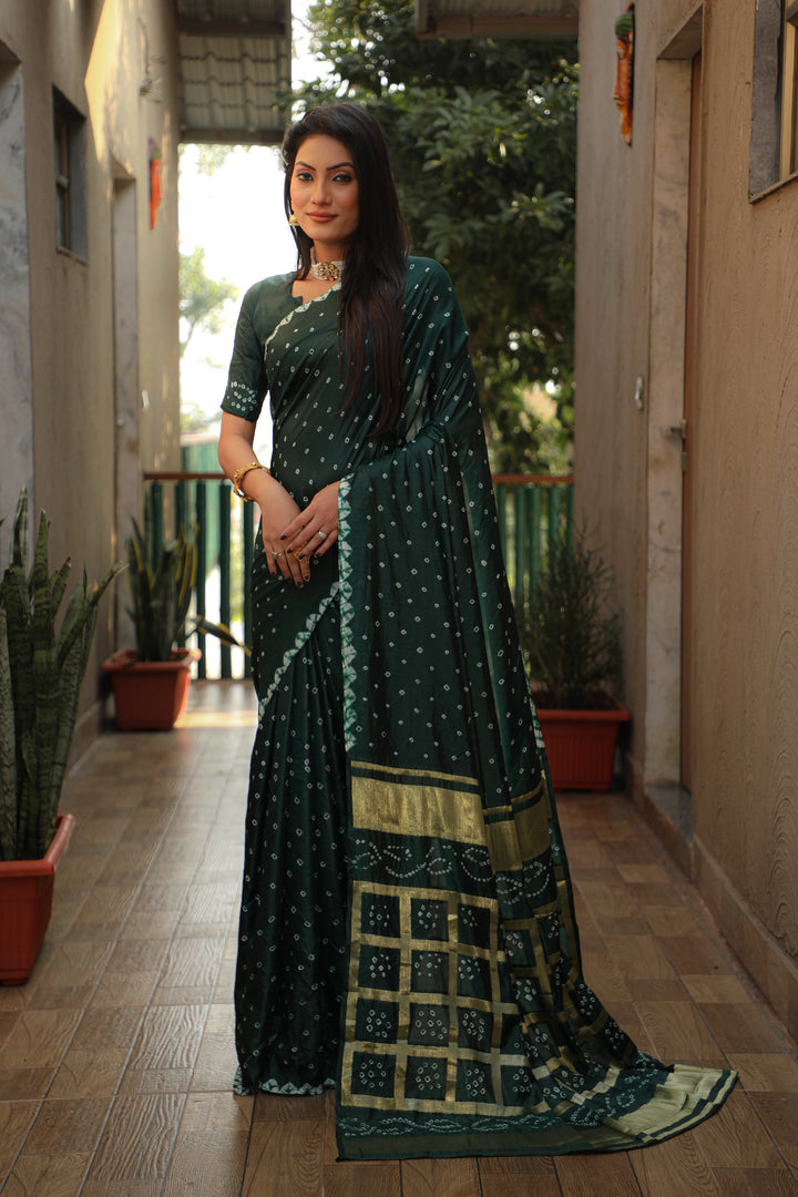 Elegant teal-green Bandhej silk saree with intricate checks design and luxurious feel.