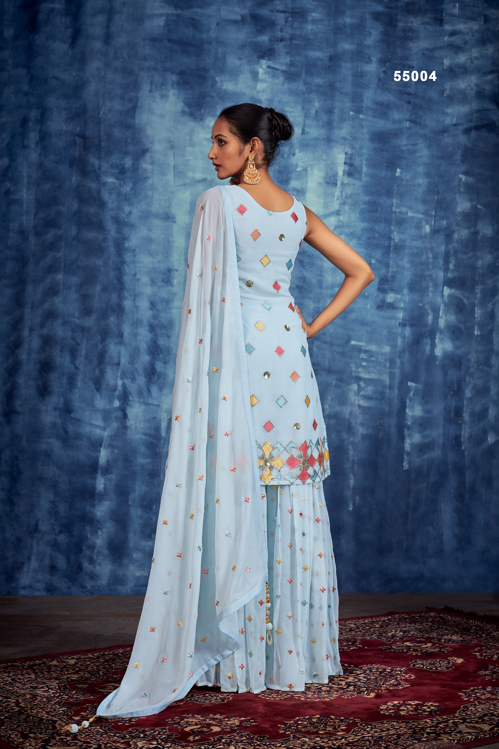 Elegant Sky Blue Gharara Suit with handwork embroidery, crystal stones, and golden zari for a festive or wedding look.