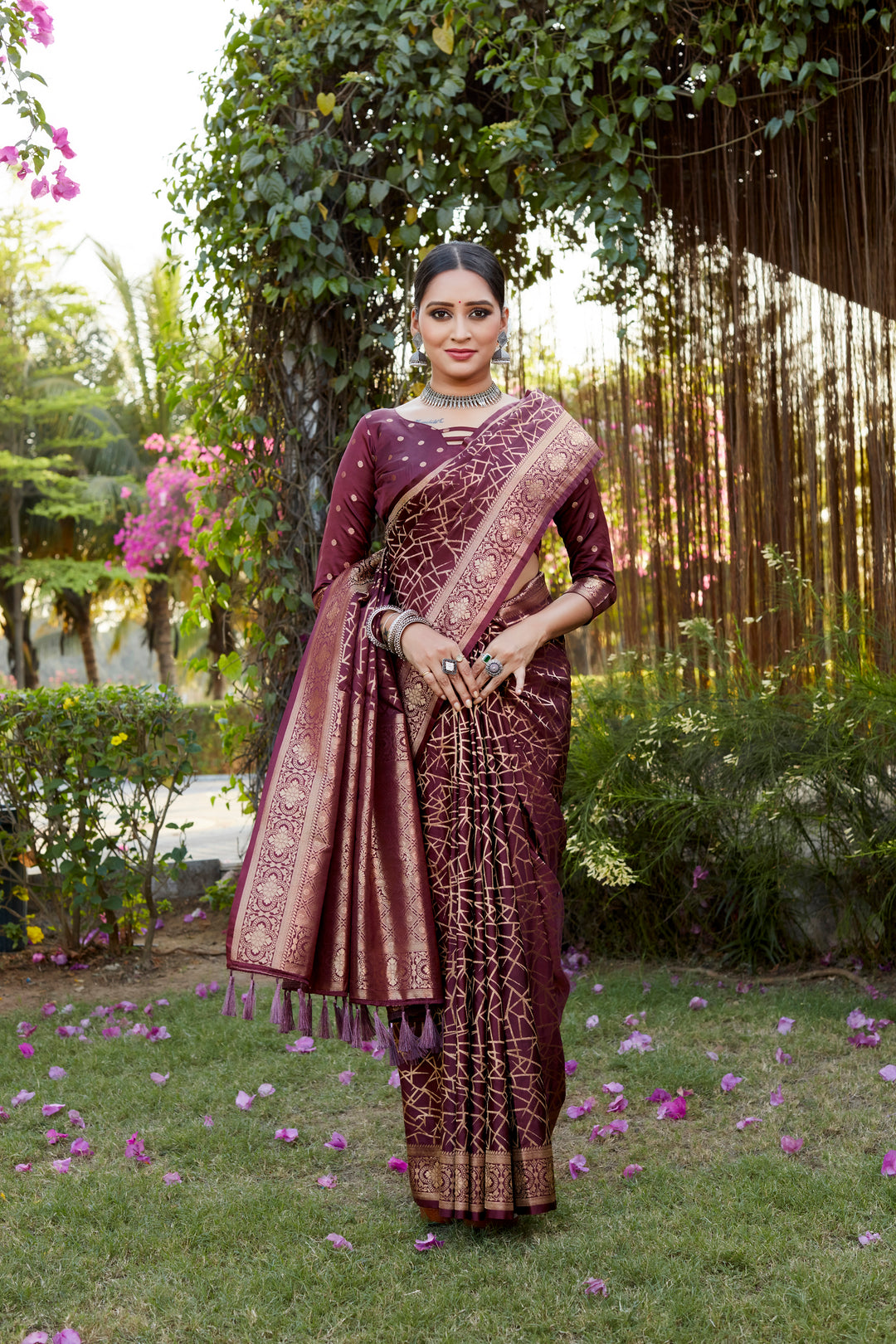 Graceful wine Kanjivaram soft satin silk saree with intricate butta design, perfect for luxury events and celebrations.