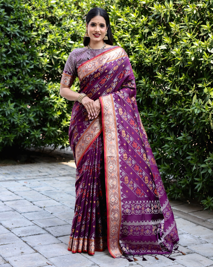 Rich purple Bandhej silk saree with zari woven pallu and matching blouse, perfect for traditional events.