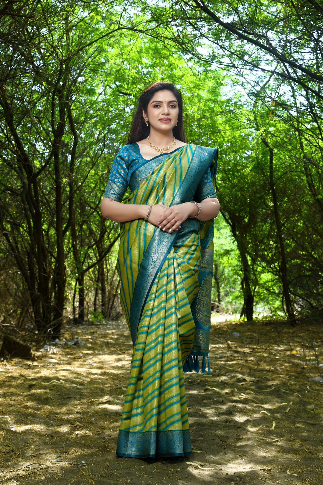 Elegant Light-Green Leheriya Soft Silk Saree featuring intricate Zari weaving and beautiful border for festive occasions.