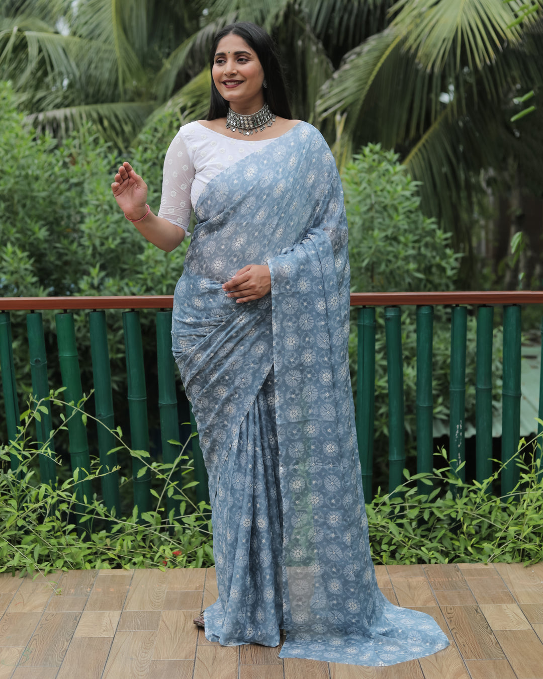 Beautiful grey chiffon saree with delicate foil detailing, perfect for formal events.