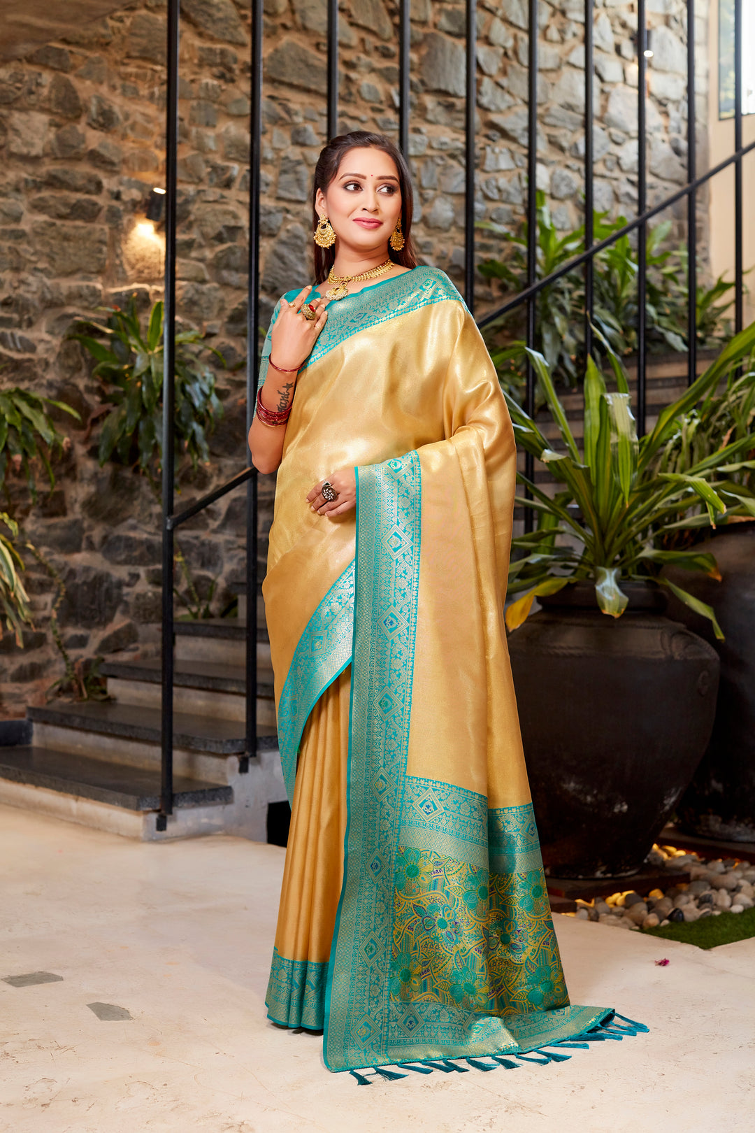 Golden Tissue silk saree with intricate weaving and stunning contrast border design.