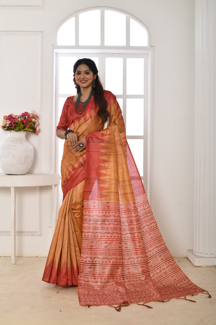 Soft Tussar silk saree featuring a beautiful printed temple border and traditional fabric pattern.