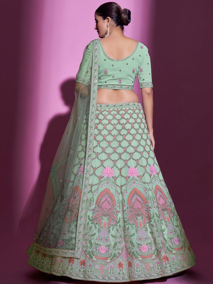 Pista green lehenga with intricate thread, stone, and zari embroidery.