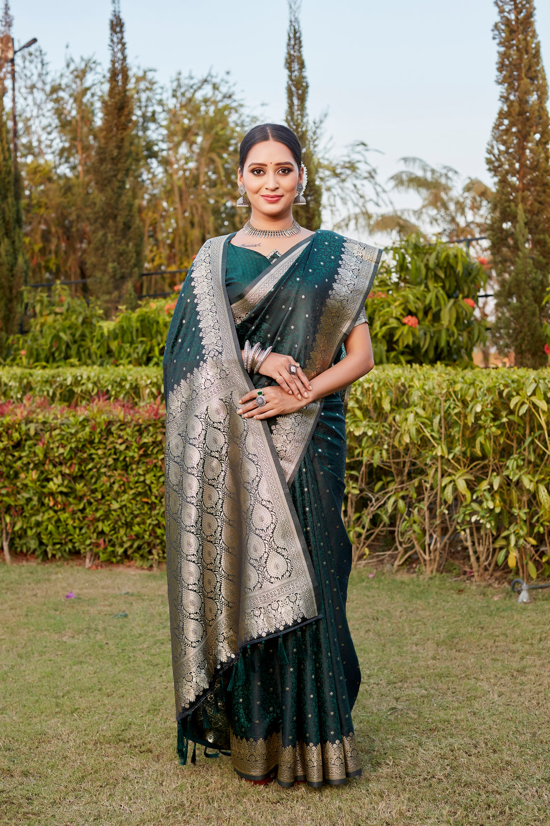 Stunning Dark-Green Kanjivaram Satin Silk Saree with intricate Butta design and elegant designer border.