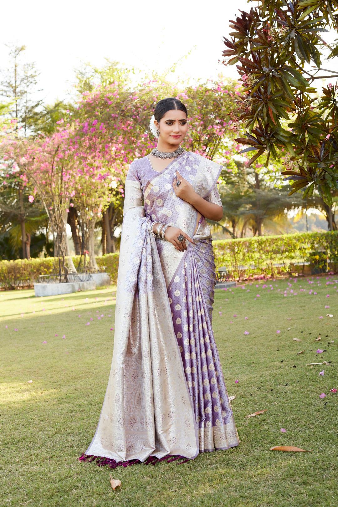 Purple Kanjivaram Soft Satin Silk saree with rich weaving butta work, satin border, and stunning woven pallu.