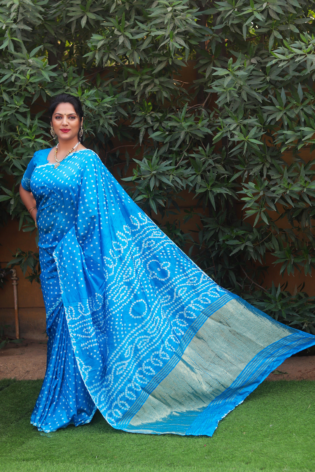 Sky blue traditional Bandhej saree in luxurious silk, designed with Zari Weaving Pallu, ideal for special occasions in the USA.