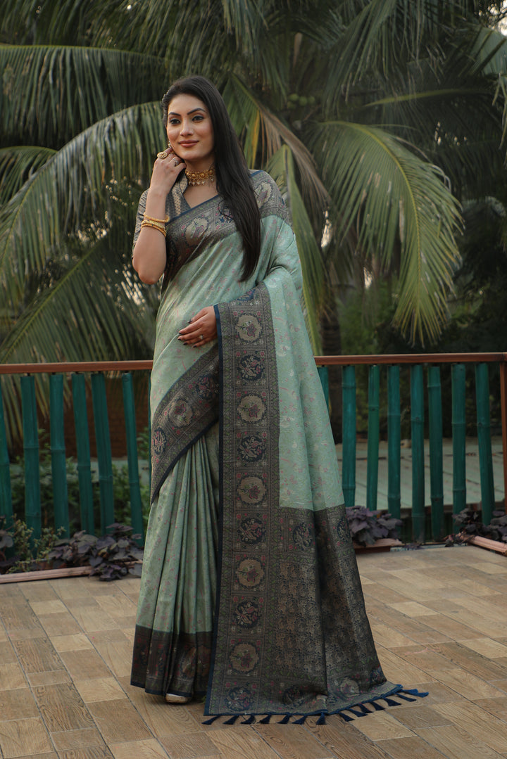 Gorgeous green silk saree with rich Kanjivaram work and exquisite borders, ensuring an elegant appearance for any festivity.