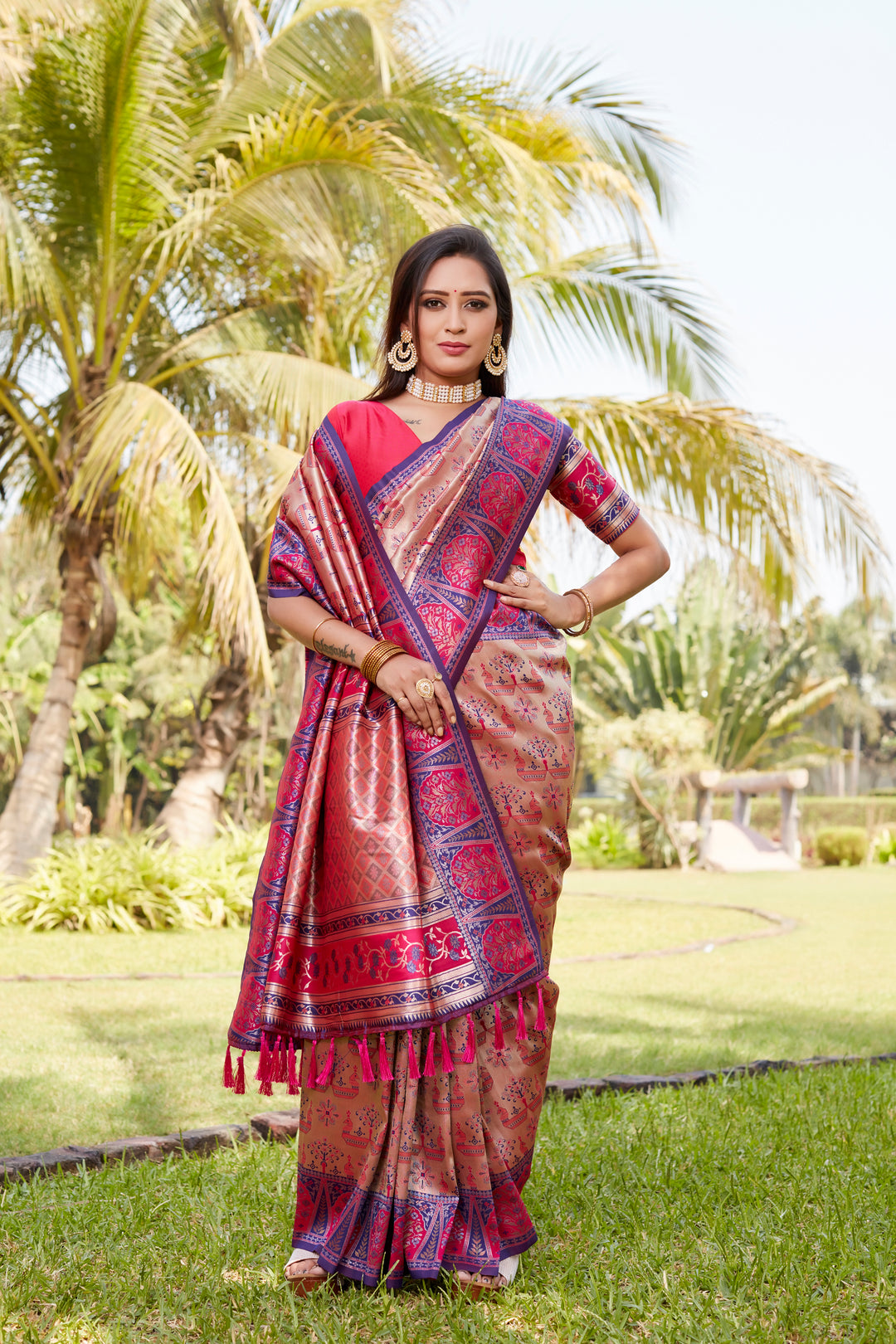 Graceful pink Kanjivaram saree featuring a rich woven pallu and exquisite embroidery, perfect for festive celebrations.