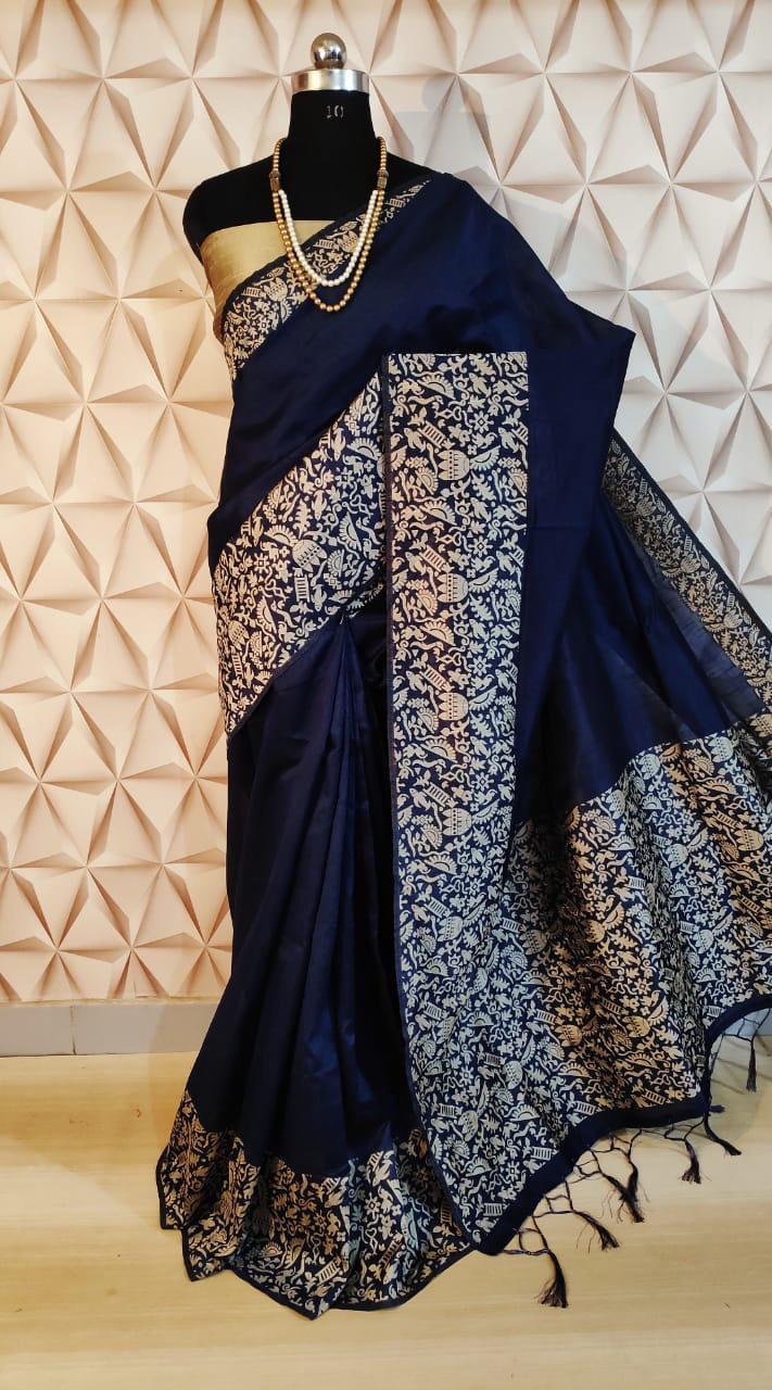 Timeless navy handloom raw silk saree with luxurious pallu detailing, perfect for grand celebrations.