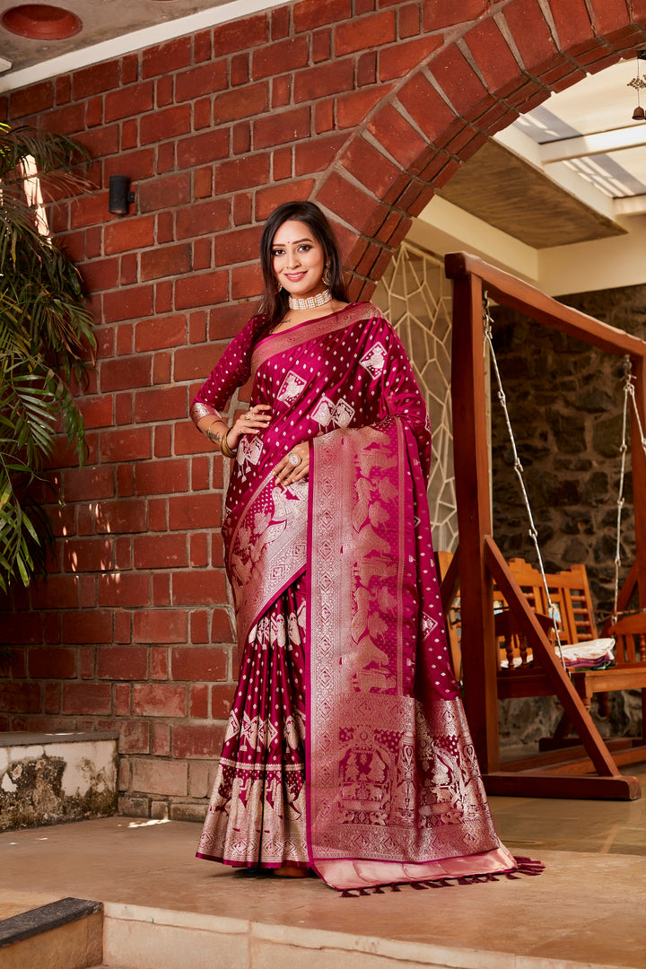 Stunning wine saree crafted from soft satin silk, showcasing intricate butta work and a luxurious woven pallu for an elegant look.