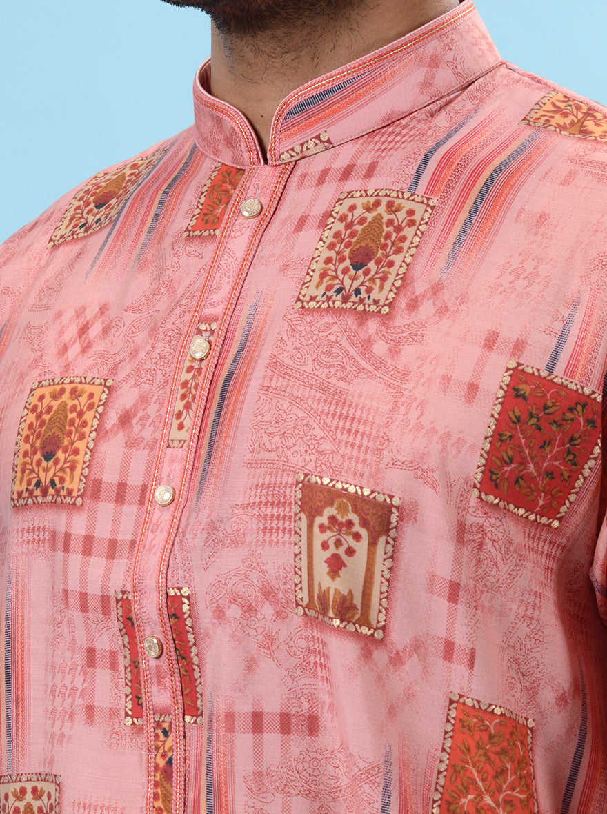 Men’s pink silk kurta pajama, a stylish choice for weddings and cultural ceremonies.