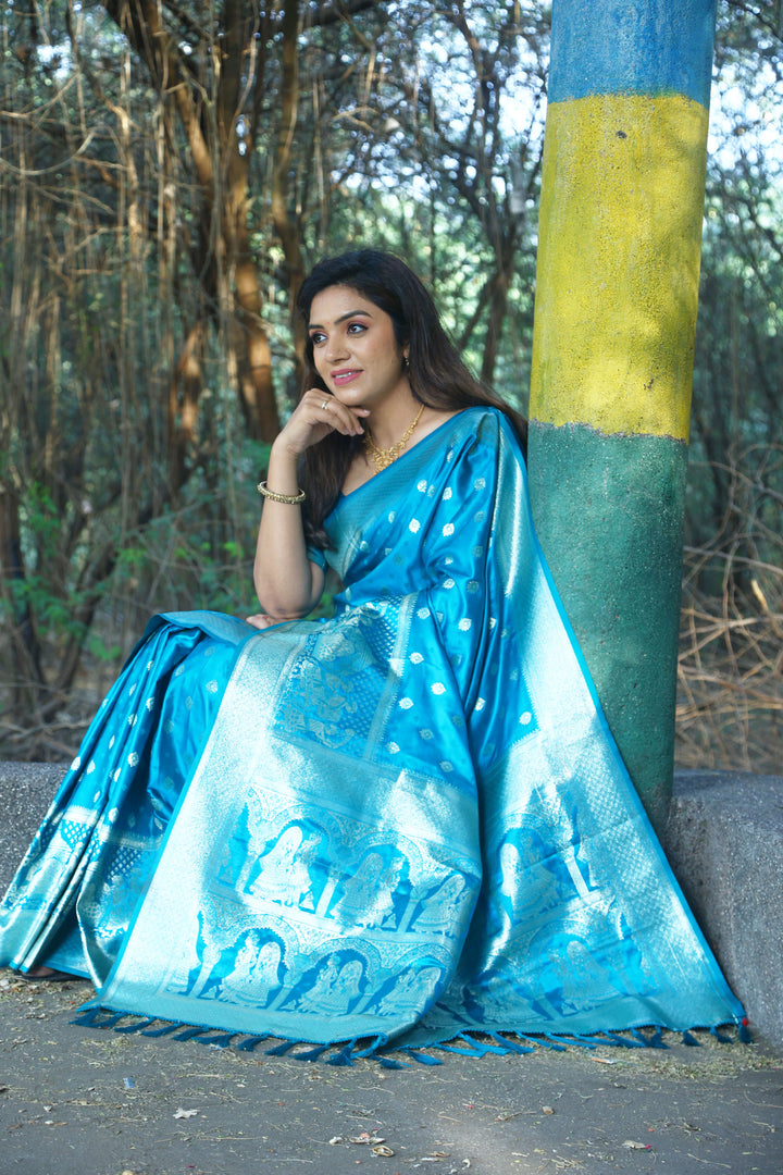 Traditional blue satin silk saree with Kanjivaram weaving design, perfect for special occasions and festive wear.