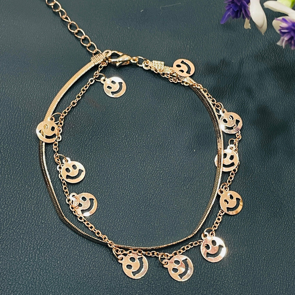 Trendy rose gold bangle with a polished finish, ideal for layering with other bracelets.